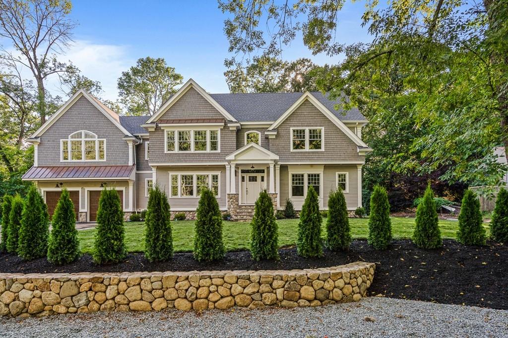 432 South Border Road Winchester, MA 01890 - Photo 1 of 40 a front view of a house with a garden