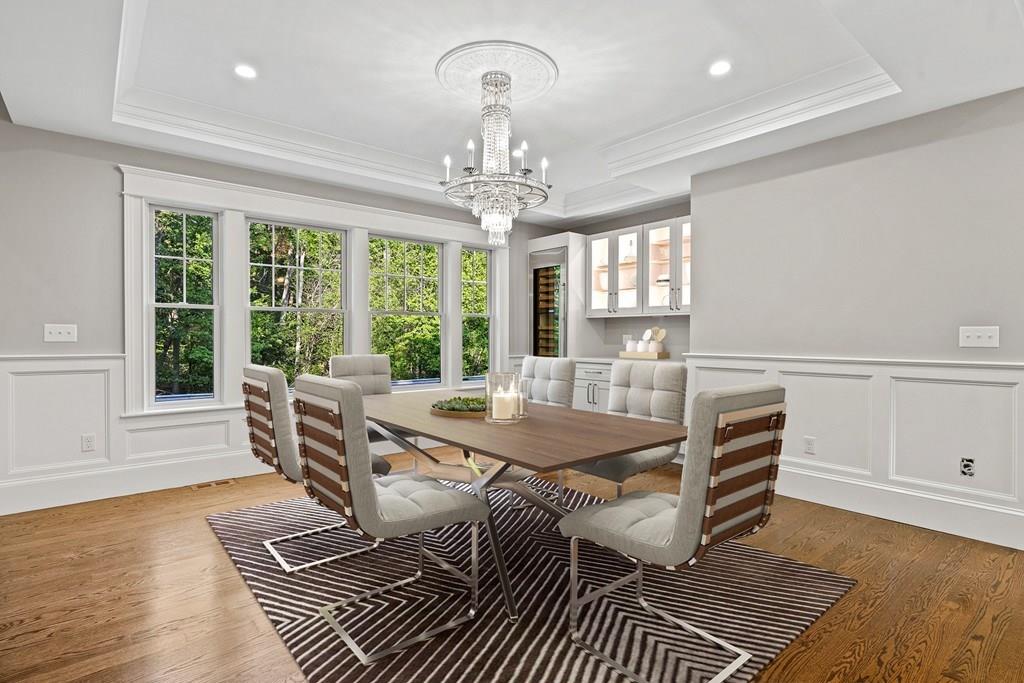 432 South Border Road Winchester, MA 01890 - Photo 13 of 40 a dining room with furniture a chandelier and wooden floor