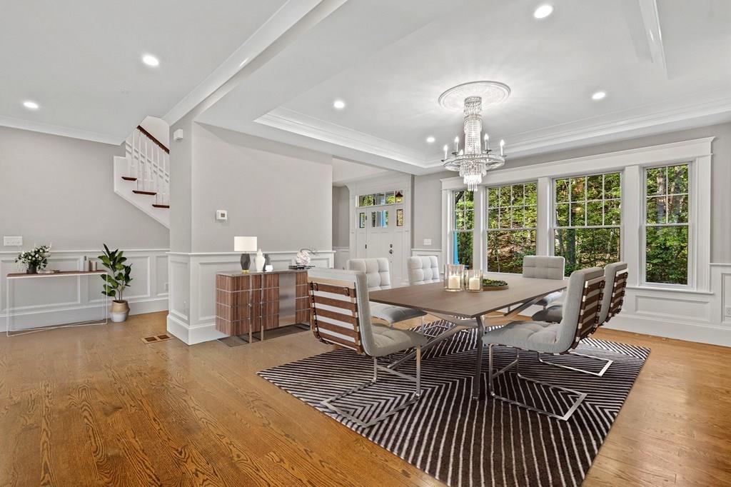 432 South Border Road Winchester, MA 01890 - Photo 14 of 40 a dining room with furniture a chandelier and wooden floor