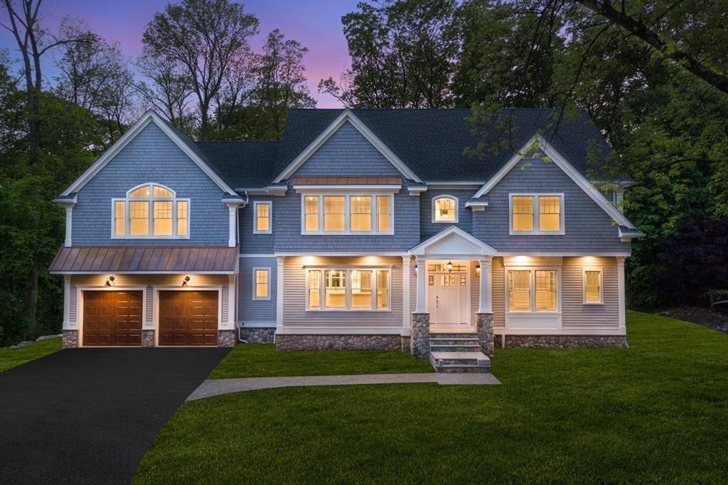 432 South Border Road Winchester, MA 01890 - Photo 2 of 40 a front view of a house with a yard