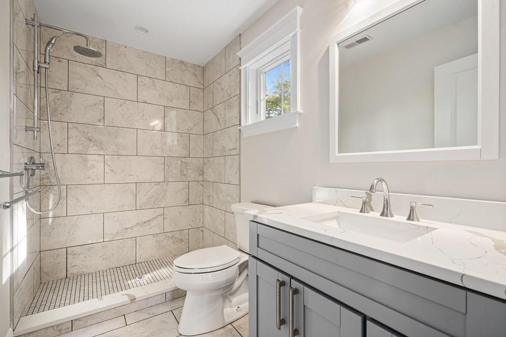 432 South Border Road Winchester, MA 01890 - Photo 26 of 40 a bathroom with a sink a toilet and shower