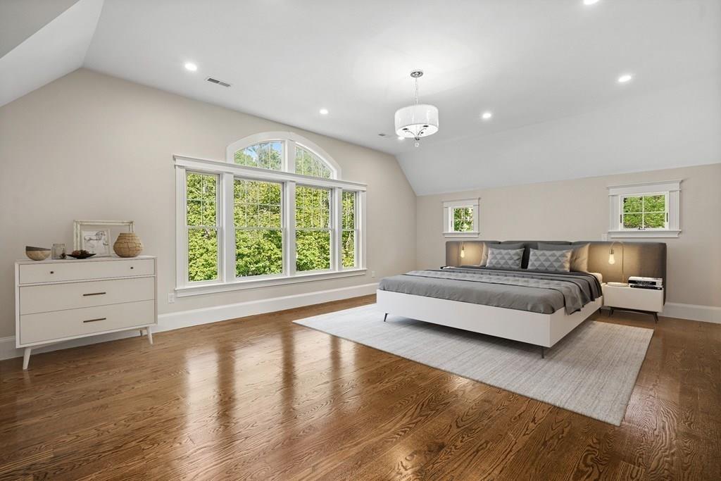 432 South Border Road Winchester, MA 01890 - Photo 30 of 40 a spacious bedroom with a large bed and a large window