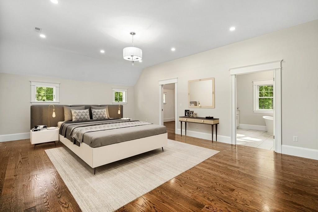 432 South Border Road Winchester, MA 01890 - Photo 31 of 40 a spacious bedroom with a bed and wooden floor