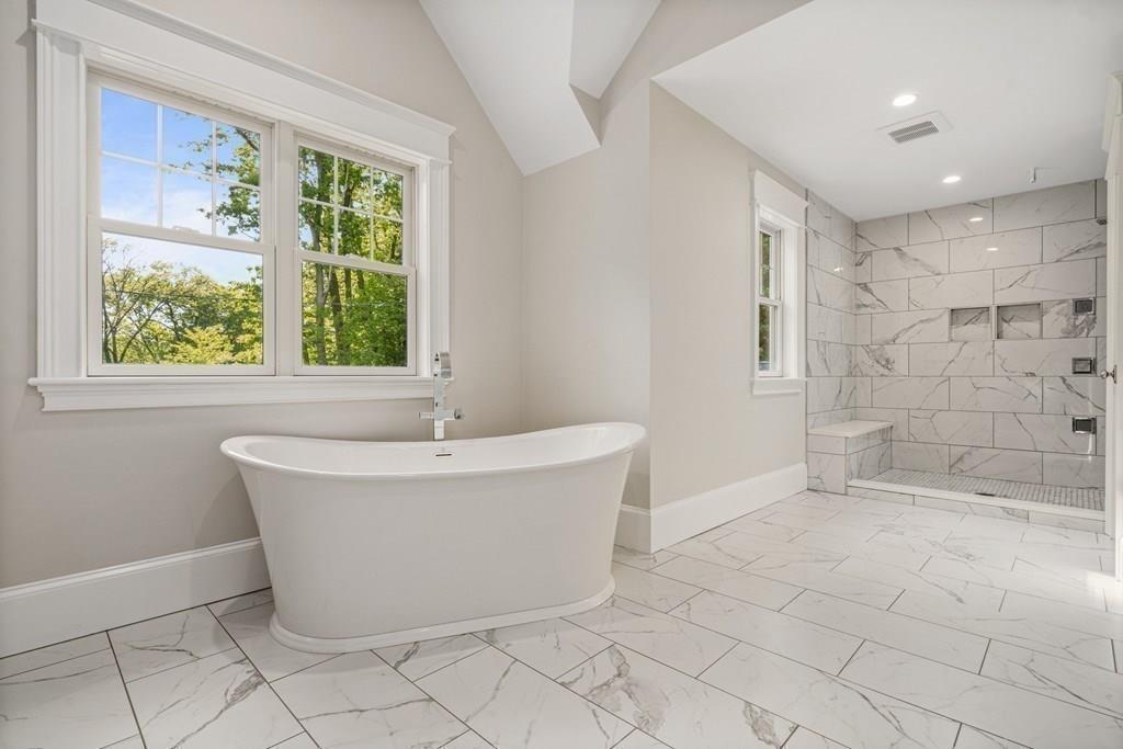 432 South Border Road Winchester, MA 01890 - Photo 32 of 40 a white bath tub sitting in a bathroom next to a window