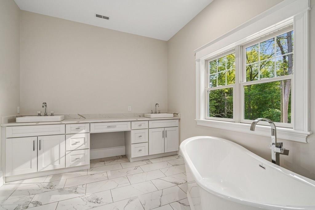 432 South Border Road Winchester, MA 01890 - Photo 34 of 40 a bathroom with a sink and a bathtub