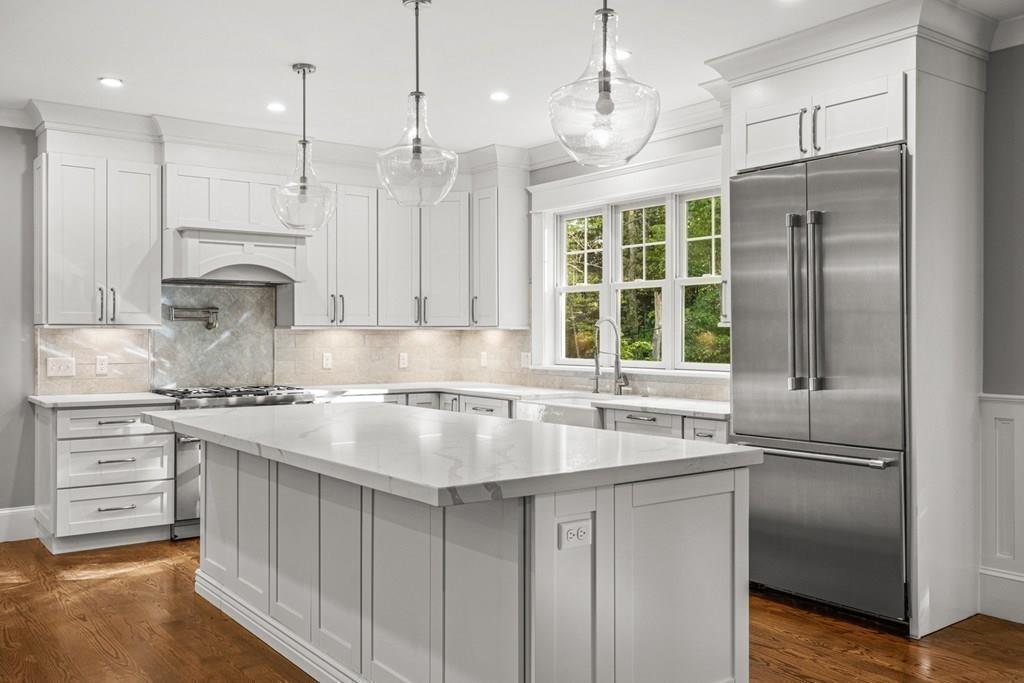 432 South Border Road Winchester, MA 01890 - Photo 40 of 40 a kitchen with stainless steel appliances granite countertop a sink stove and refrigerator