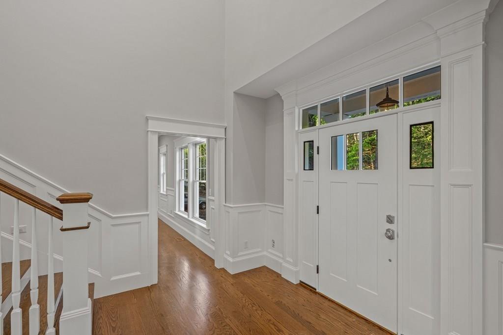 432 South Border Road Winchester, MA 01890 - Photo 4 of 40 a view of an entryway with wooden floor and door