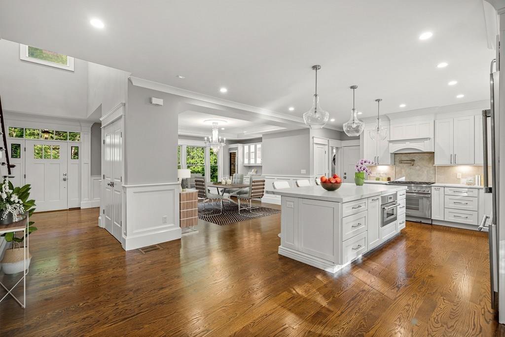 432 South Border Road Winchester, MA 01890 - Photo 9 of 40 a large white kitchen with lots of counter space wooden floor and appliances