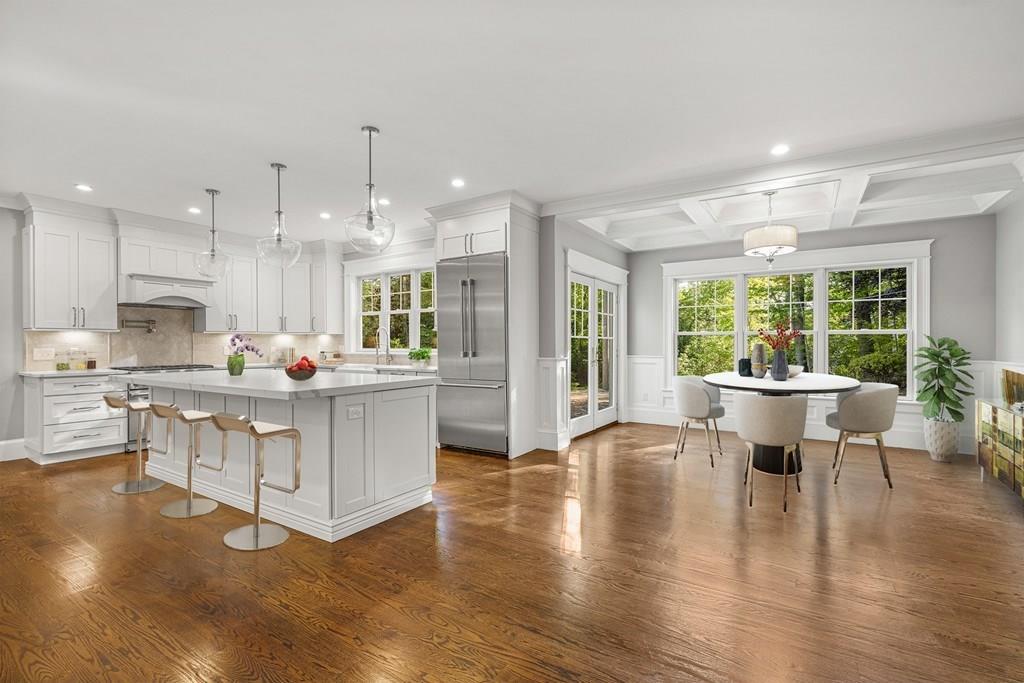 432 South Border Road Winchester, MA 01890 - Photo 10 of 40 a open kitchen with white cabinets granite counter tops and a large window