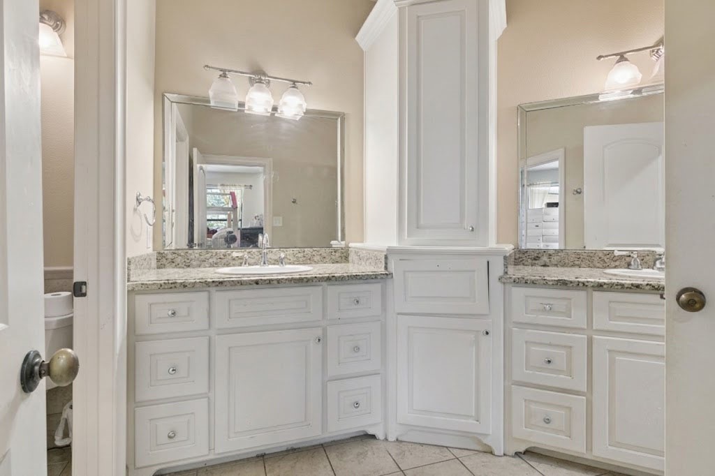 3818 Waterbend Cove Spring, TX 77386 - Photo 24 of 44 a bathroom with a granite countertop double vanity sink mirror and