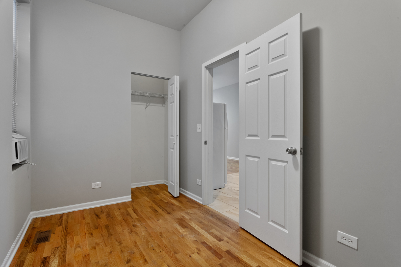 1532 West 18th Place, Unit 1R Chicago, IL 60608 - Photo 8 of 12 a bedroom with a bed and hallway