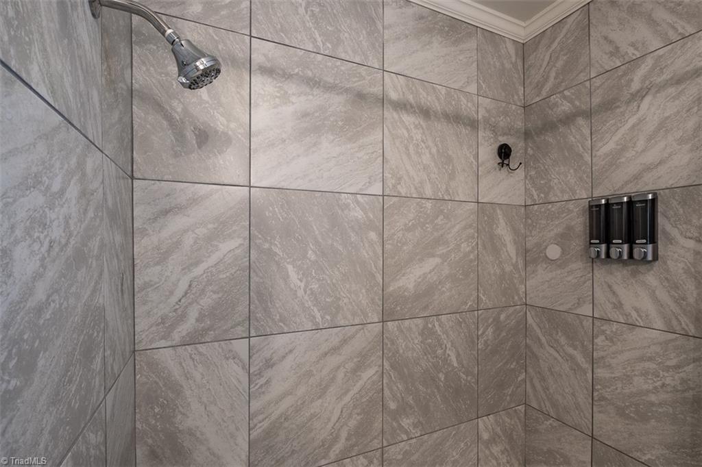 444 Elk Spur Street Elkin, NC 28621 - Photo 14 of 21 Updated bathroom features shower and tub combination.