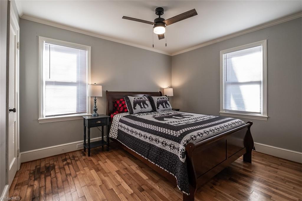 444 Elk Spur Street Elkin, NC 28621 - Photo 16 of 21 Third of three bedrooms with hardwood floors and ceiling fan