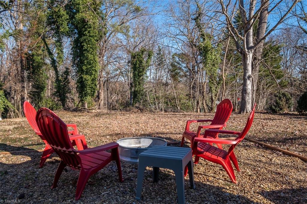 444 Elk Spur Street Elkin, NC 28621 - Photo 19 of 21 View of back yard and fire pit
