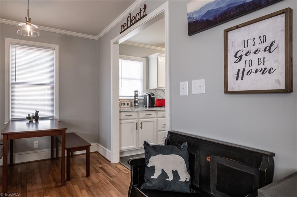 444 Elk Spur Street Elkin, NC 28621 - Photo 5 of 21 View from living room looking toward eating area and opening to kitchen on the right.