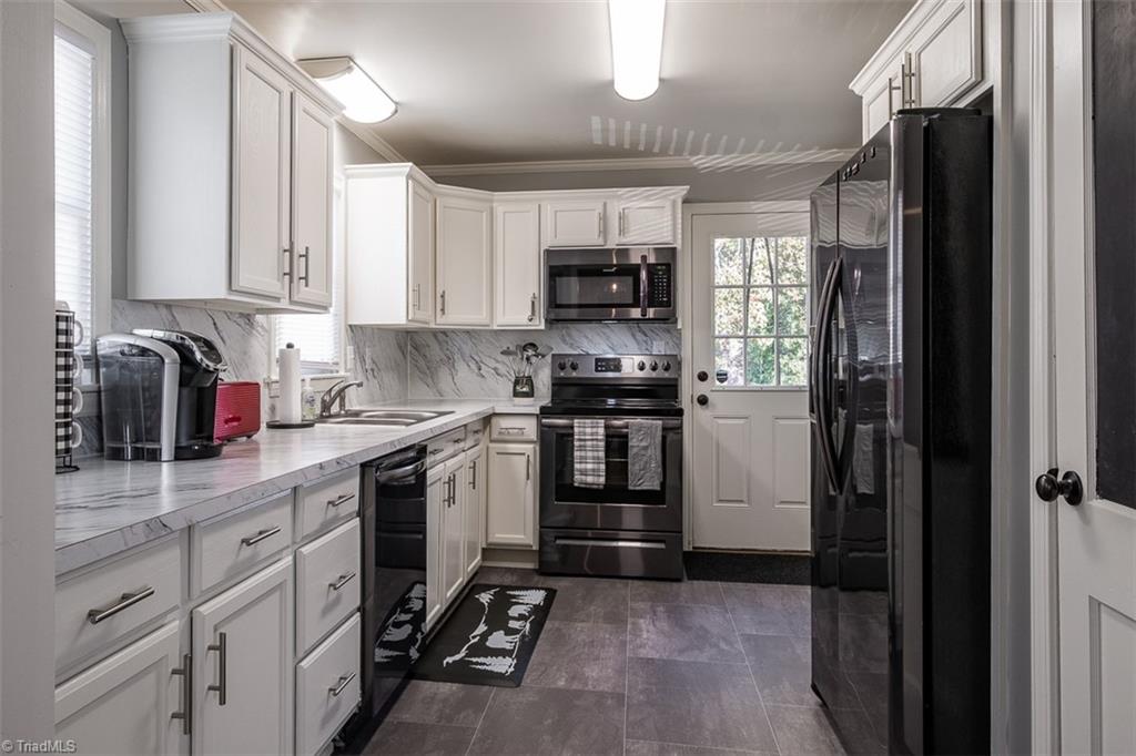 444 Elk Spur Street Elkin, NC 28621 - Photo 7 of 21 Galley-style kitchen with newer appliances.