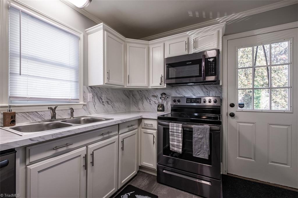 444 Elk Spur Street Elkin, NC 28621 - Photo 9 of 21 Kitchen looking toward back door.