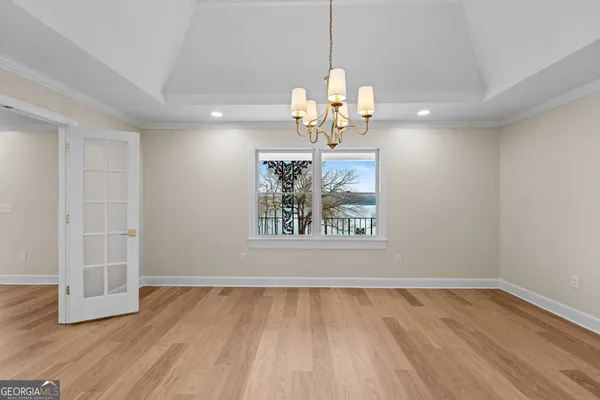 a view of a hallway view with wooden floor and staircase