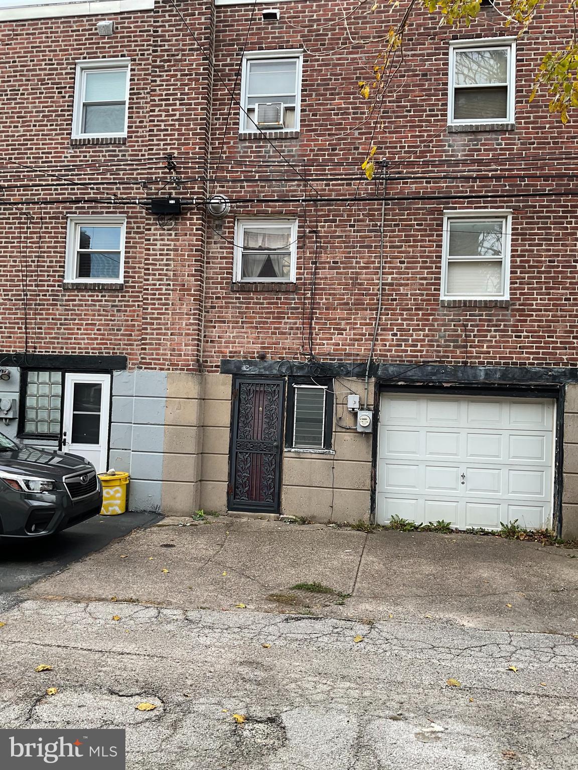 813 Arbor Road Lansdowne, PA 19050 - Photo 12 of 15 a view of a brick house with many windows