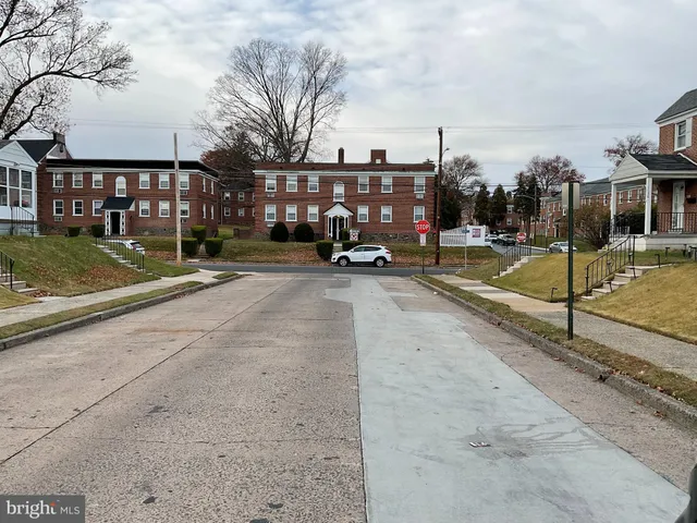a view of a park with iron fence