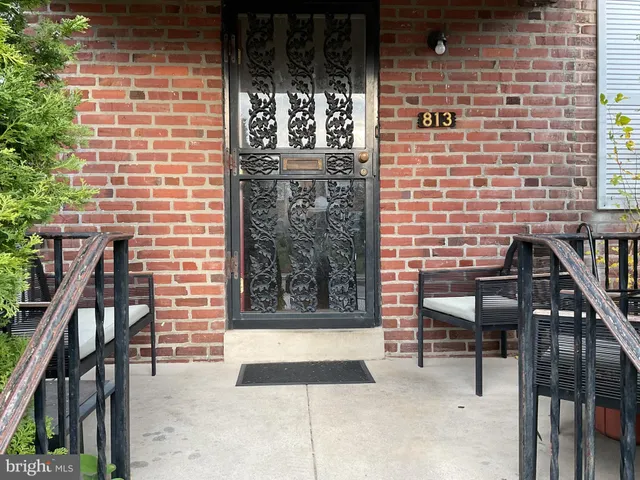 a view of front door of house with stairs