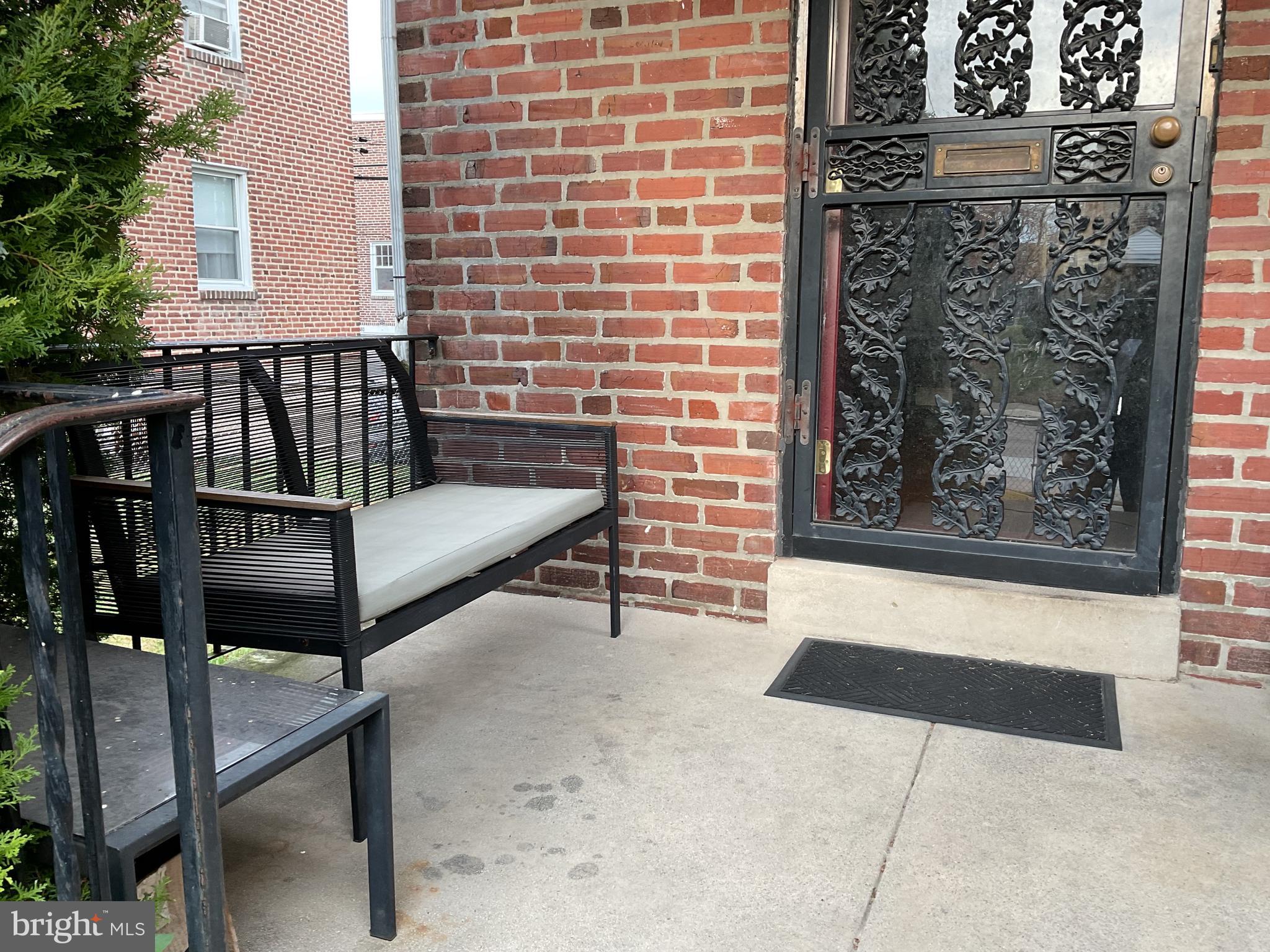 813 Arbor Road Lansdowne, PA 19050 - Photo 5 of 15 a bench sitting in front of a building