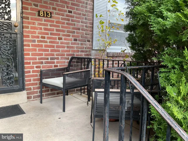 a balcony view with a seating space