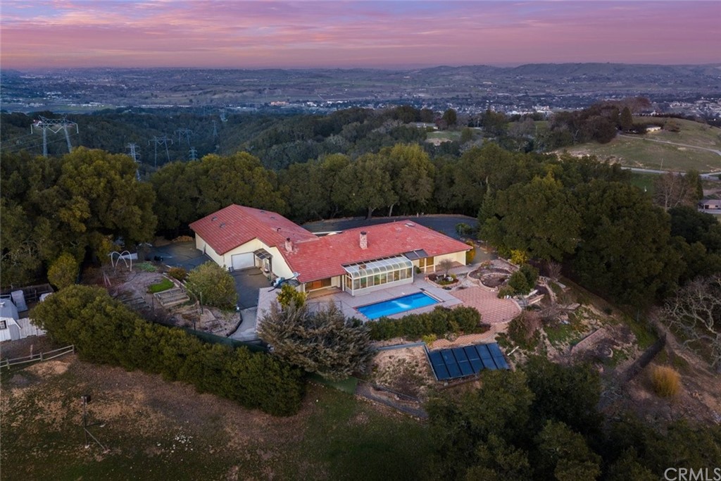 an aerial view of a house with a garden
