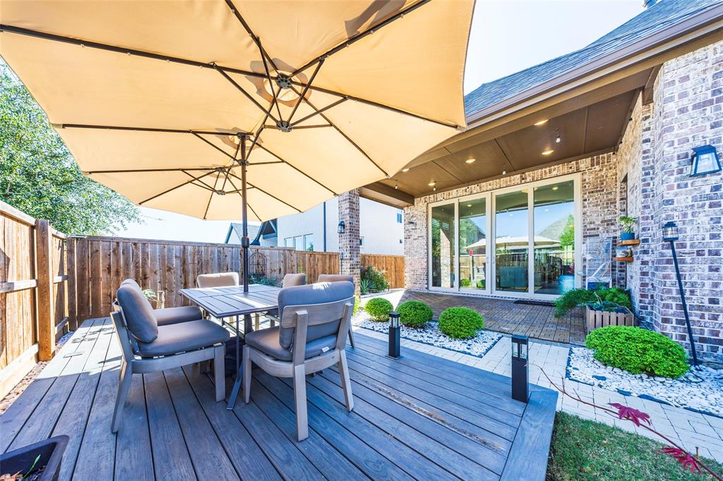 1650 Oakcrest Drive Prosper, TX 75078 - Photo 33 of 40 Deck featuring outdoor dining space and a patio area