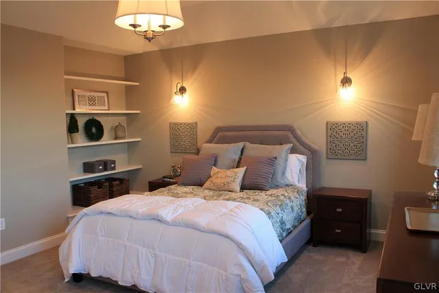 a bedroom with a bed and a cabinets