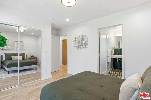 a bedroom with furniture and window