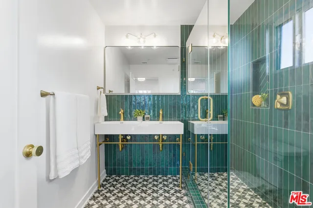 a bathroom with a sink and mirror