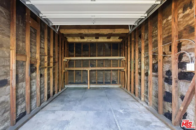 a view of a porch with wooden floor and fence