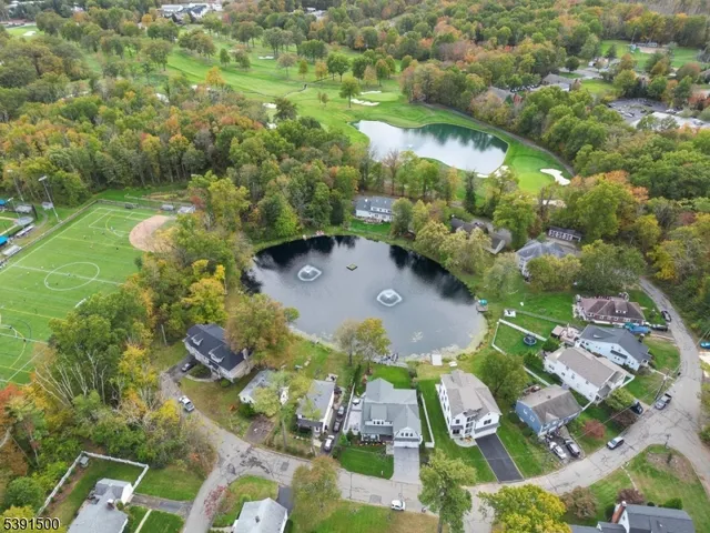a spacious bedroom with a bed and glass window