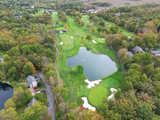 a kitchen with cabinets stainless steel appliances and a counter space