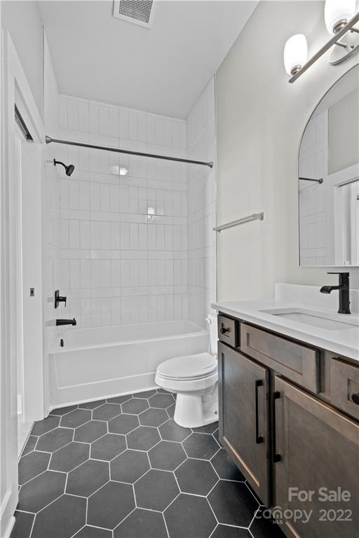 3279 Noda Boulevard Charlotte, NC 28205 - Photo 13 of 20 a bathroom with a sink a toilet and shower