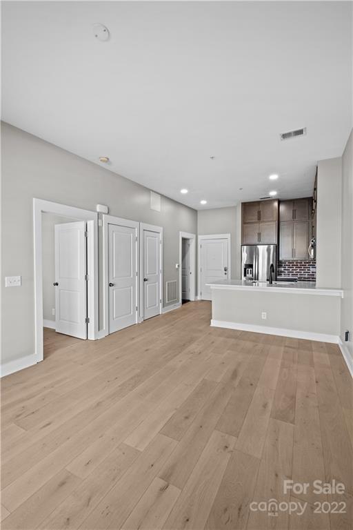 3279 Noda Boulevard Charlotte, NC 28205 - Photo 8 of 20 a view of an empty room with kitchen and window