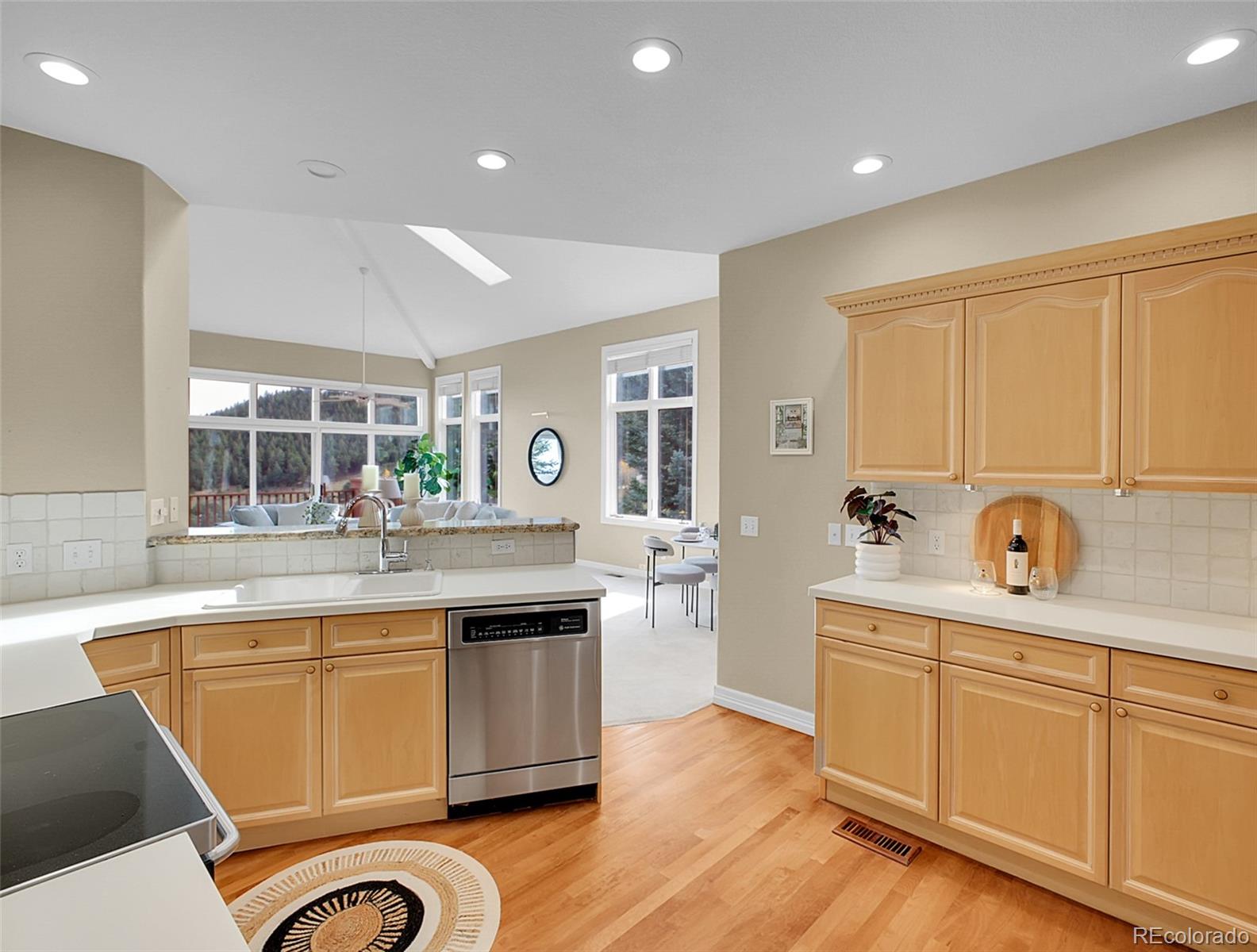 568 Ridgeside Drive Golden, CO 80401 - Photo 12 of 48 a kitchen with sink stove and refrigerator