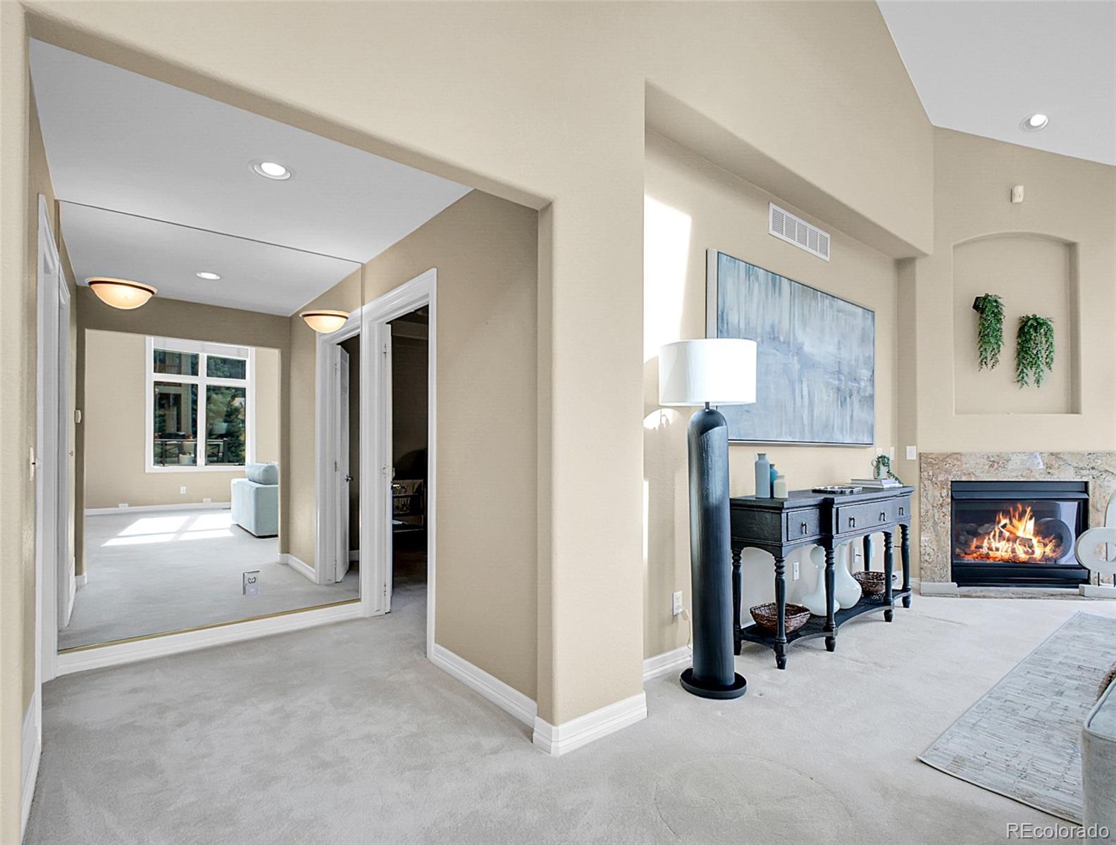 568 Ridgeside Drive Golden, CO 80401 - Photo 15 of 48 a view of a livingroom with a fireplace and workspace