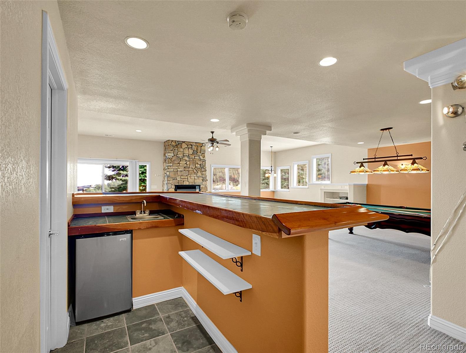 568 Ridgeside Drive Golden, CO 80401 - Photo 29 of 48 a kitchen with stainless steel appliances granite countertop a sink and a refrigerator