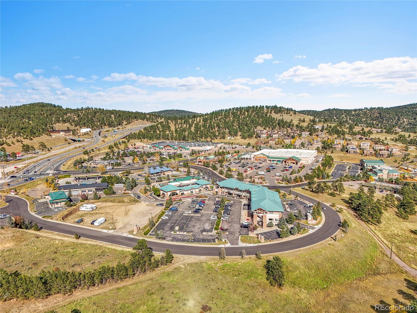 568 Ridgeside Drive Golden, CO 80401 - Photo 40 of 48 a view of a swimming pool with a lot of buildings in the background