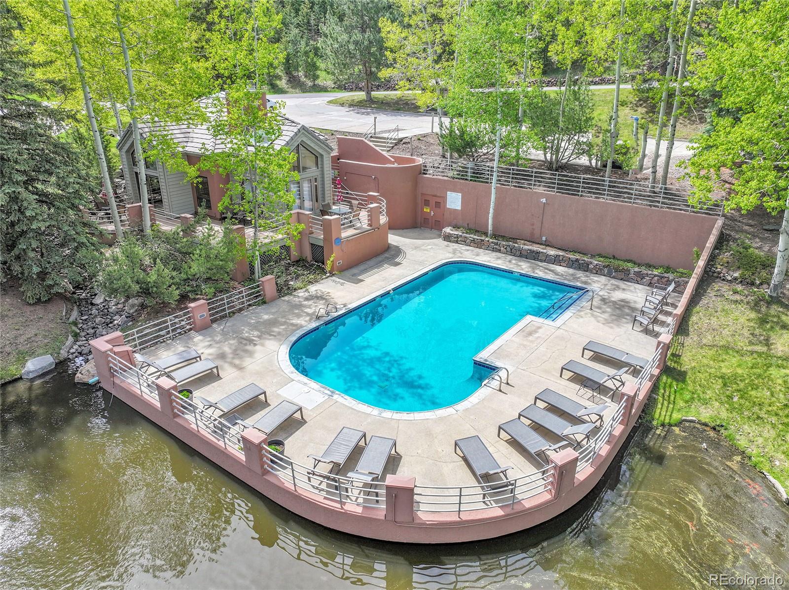 568 Ridgeside Drive Golden, CO 80401 - Photo 7 of 48 a view of a swimming pool with a patio