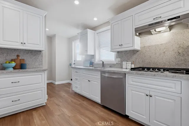 a bathroom with a double vanity sink toilet and shower