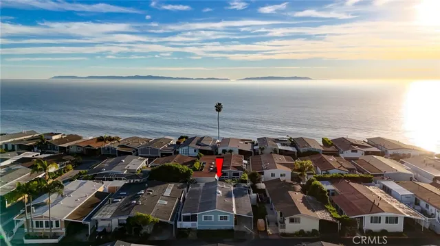 a very nice looking room with wooden floor and furniture