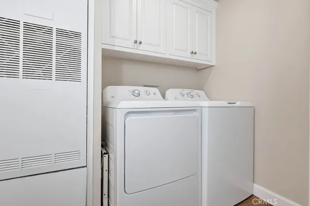 a view of a livingroom with an empty space and a fireplace