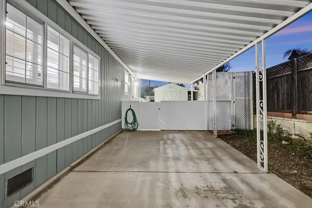a view of a livingroom with fireplace and window