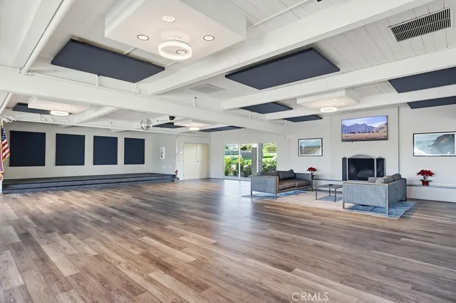 a outdoor dining space with furniture and wooden floor