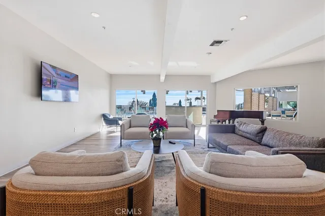 a view of a swimming pool with lawn chairs and a yard