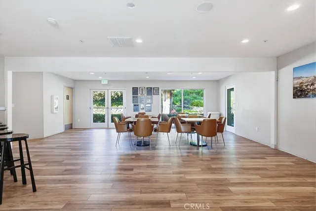 a view of a street with wooden fence