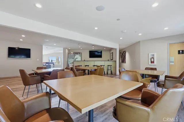 a view of a lake with table and chairs